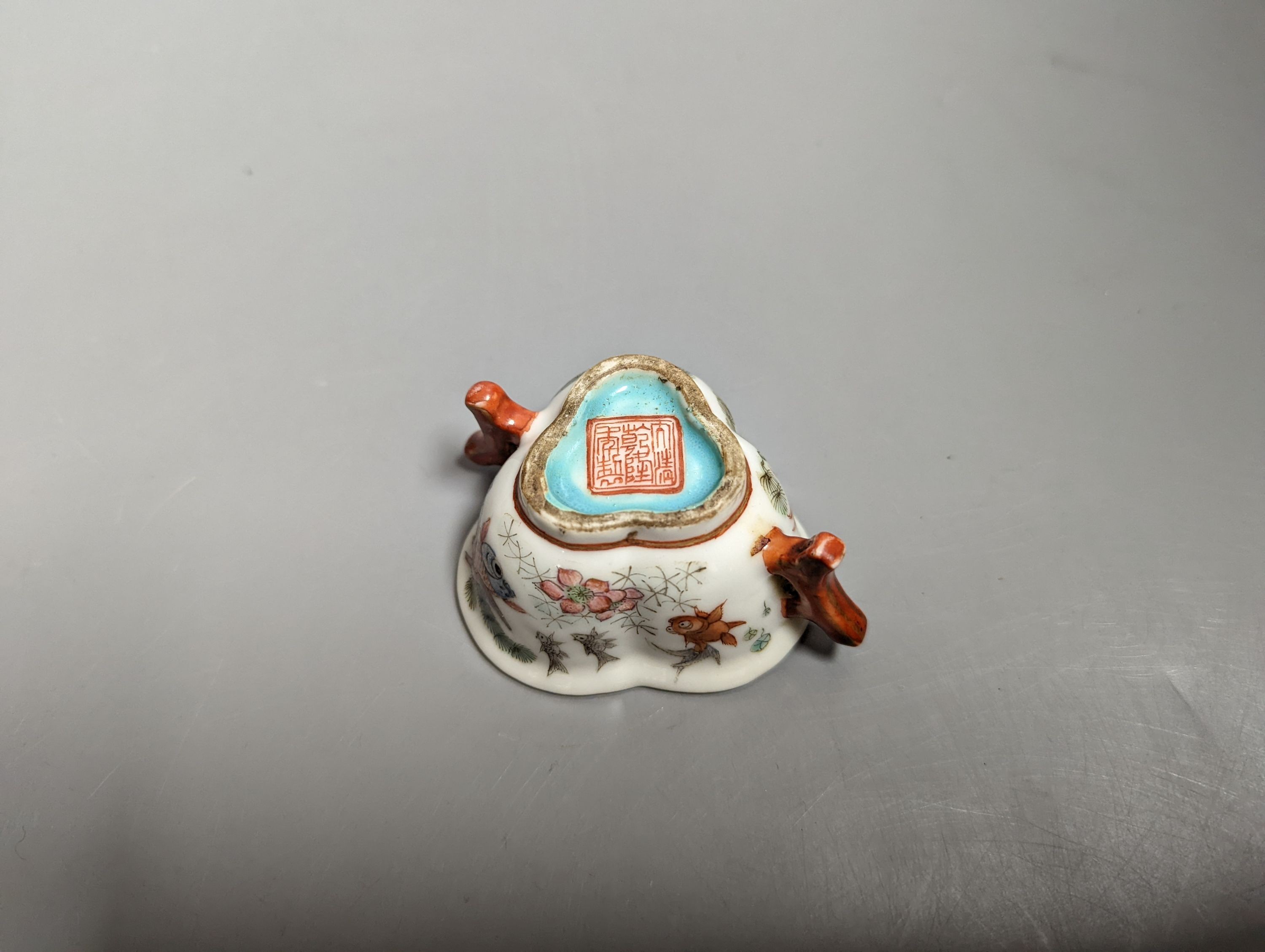 A Chinese enamelled porcelain 'goldfish' cup, Qianlong mark but 19th century, 3cms high